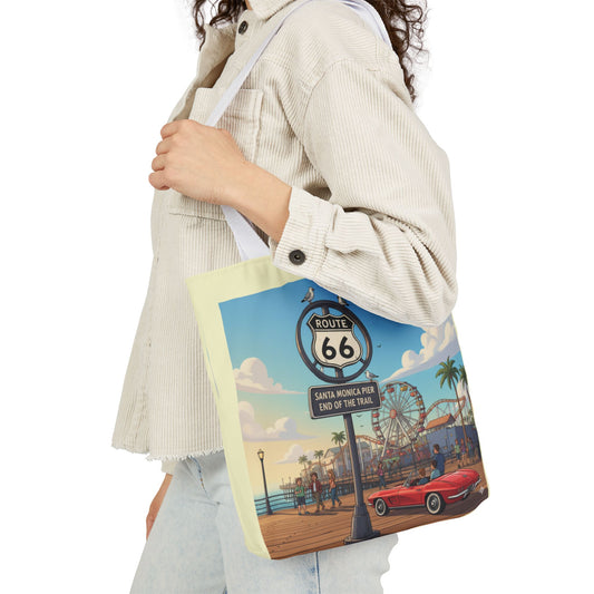 Over-the-shoulder view of Route 66 Santa Monica Pier End of the Trail tote bag with a white handle and featuring a colorful beach and boardwalk design