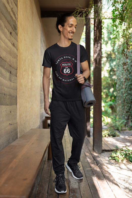 Male model wearing black retro Route 66 unisex jersey tee with Santa Rosa, NM: "City of Natural Lakes" design