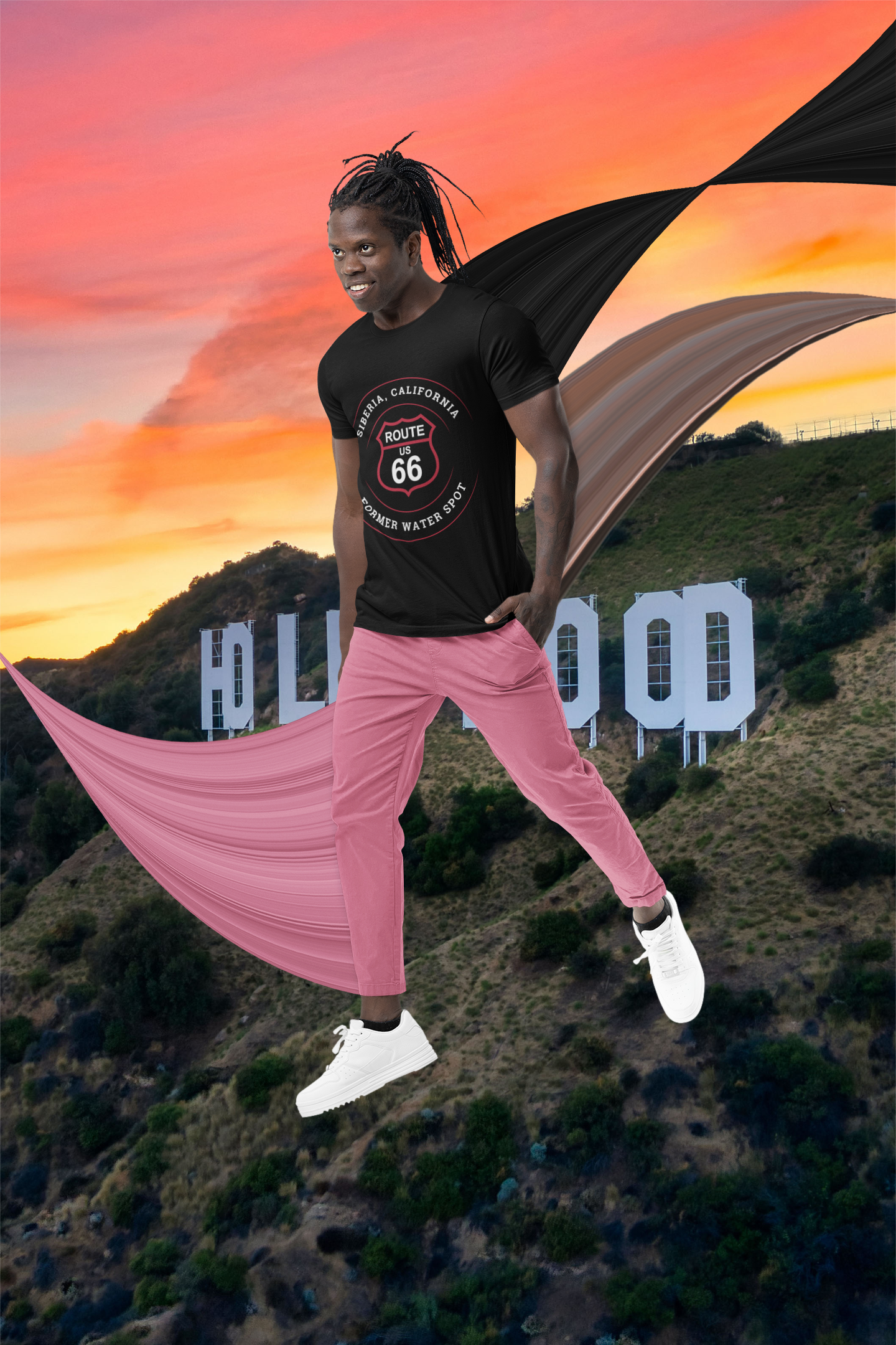 Male model wearing black retro Route 66 unisex jersey tee with Siberia, CA: "Former Water Spot" design, styled with tan pants, brown jacket and striped scarf with a Hollywood-styled pop-art background