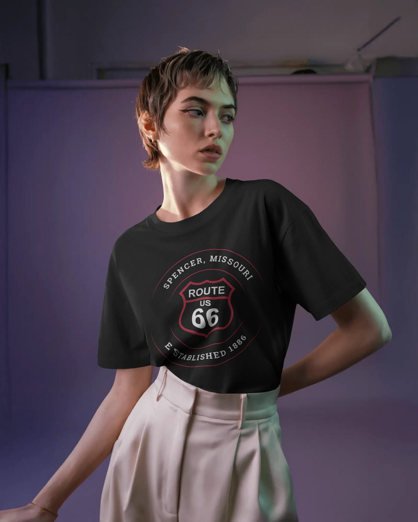 Female model wearing vintage black retro Route 66 unisex jersey tee with Spencer, MO "Established 1886" design