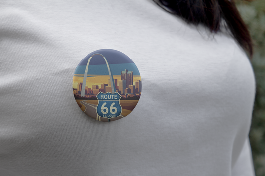 Route 66 St. Louis Gateway to the West pin button with a St Louis skyline with the arch design, worn on a white shirt.