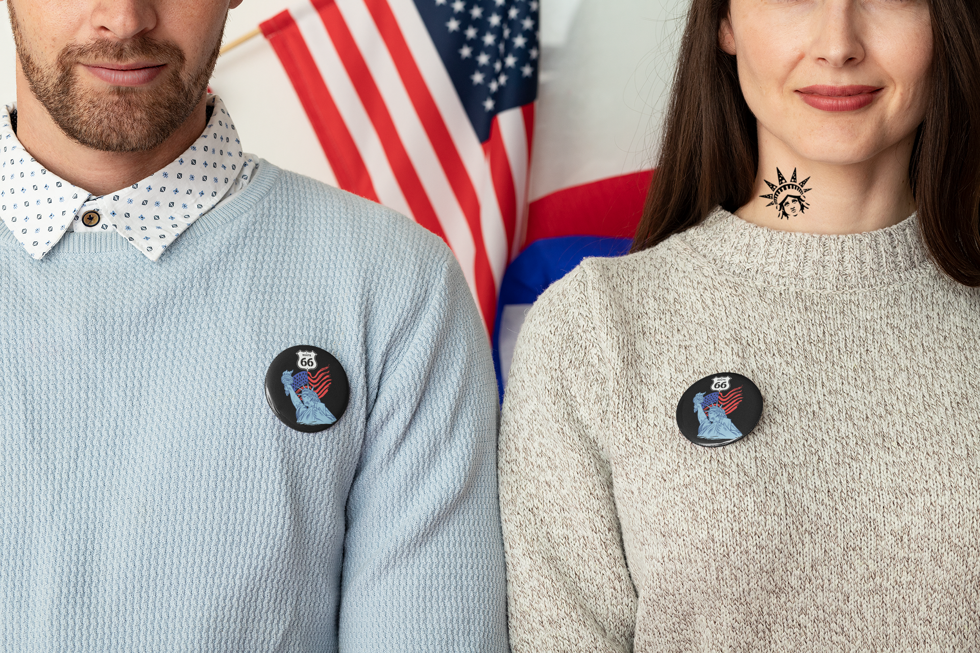 Man and woman wearing Route 66 Statue of Liberty pin buttons with Route 66 shield and American flag design. The pins are attached on their business attire outfits, showcasing how this pin can be used for all outfits.