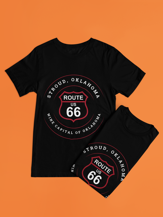 Black retro Route 66 t-shirts displayed - one folded and the other laid out next to it, both against an orange background.
