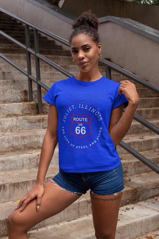 Smirking woman wearing a tri-blend vintage royal tee featuring a retro Route 66 Joliet IL "The City of Steel and Stone" graphic.