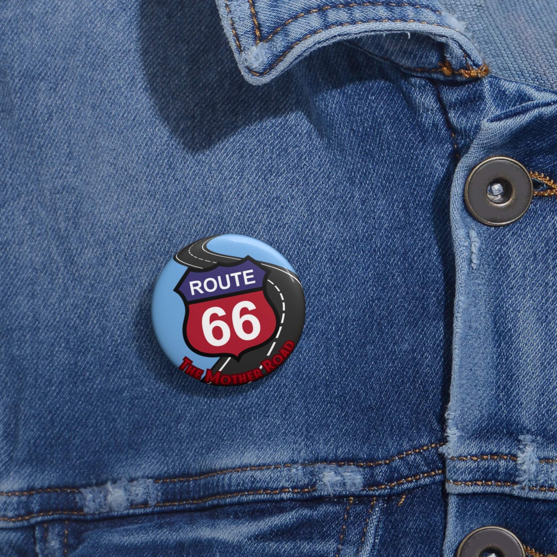 Route 66 vintage shield pin button with "The Mother Road" design on a dark blue denim jacket, ideal for road trip outfits and classic Americana fashion