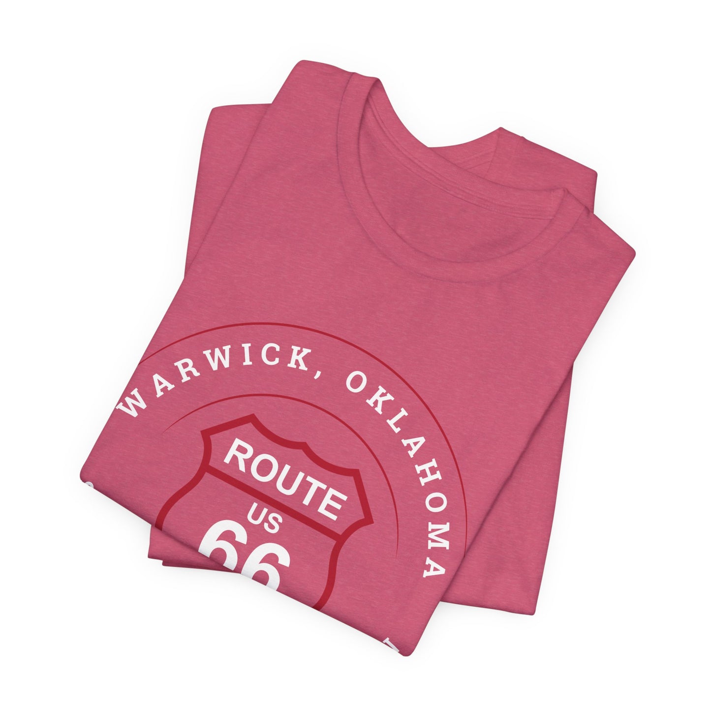 A folded heather raspberry retro Route 66 unisex jersey tee with Warwick, OK "Site of Seaba's Station" design