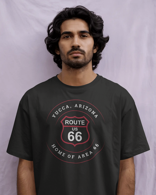 Male model wearing vintage black retro Route 66 unisex jersey tee with Yucca, AZ: "Home of Area 66" design
