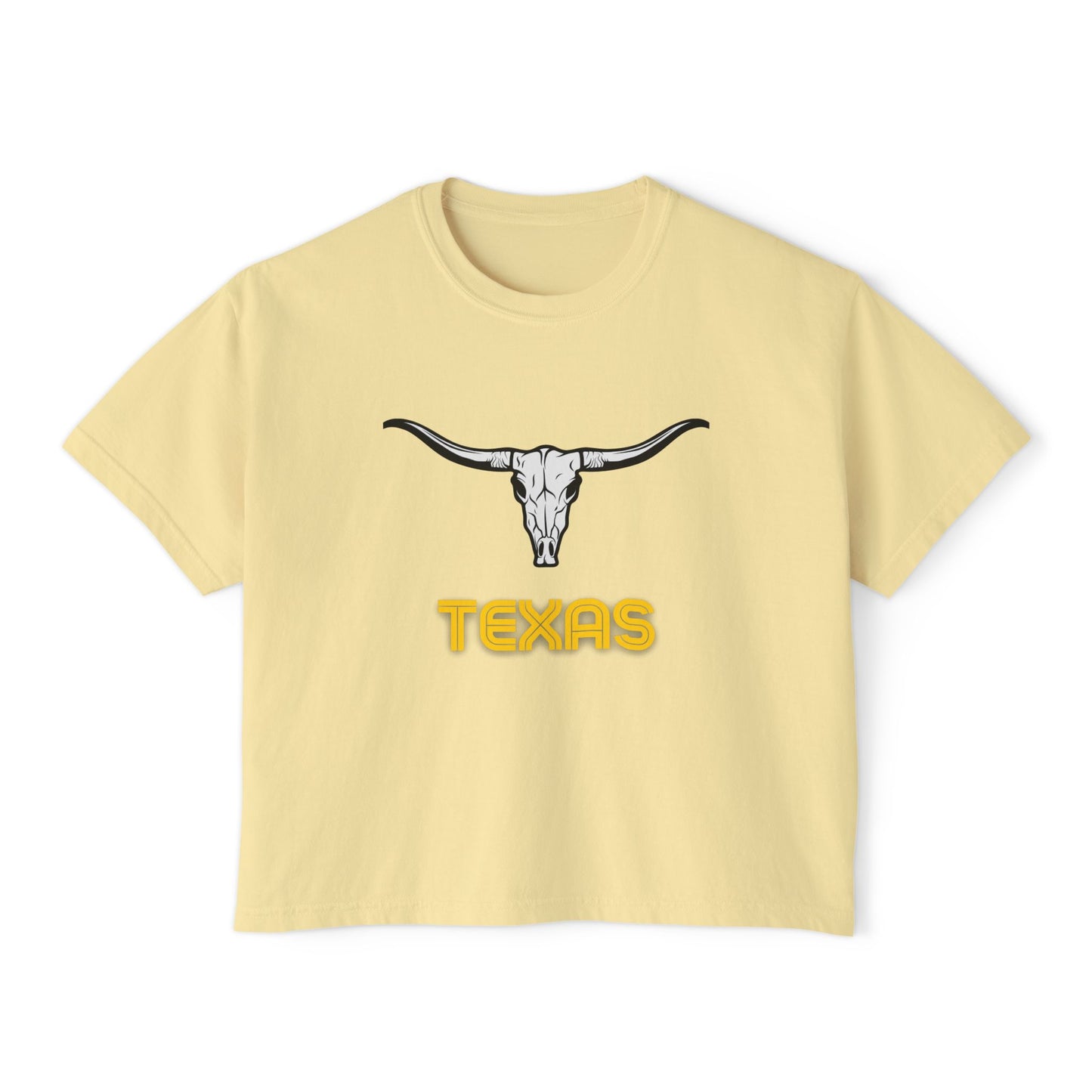 Flat lay of butter-yellow Texas Longhorn boxy tee featuring a black longhorn skull graphic and bold yellow "Texas" text